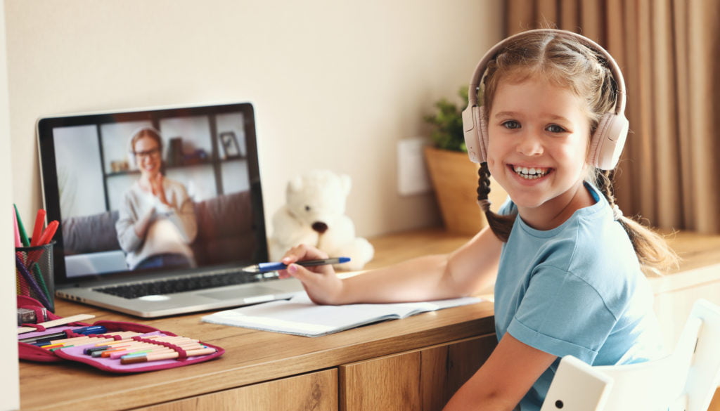 Cheerful girl during online lesson at home